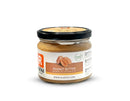 Creamy peanut butter in a glass jar, perfect for spreading, baking, or adding to smoothies.
